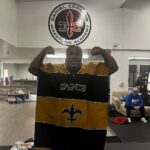 Daniel Cormier Instagram - Couple of my kids went down to Mexico and gave coach a gift. #gosaints it’s my new everyday wear. @danielcormierwrestlingacademy @gilroywrestling