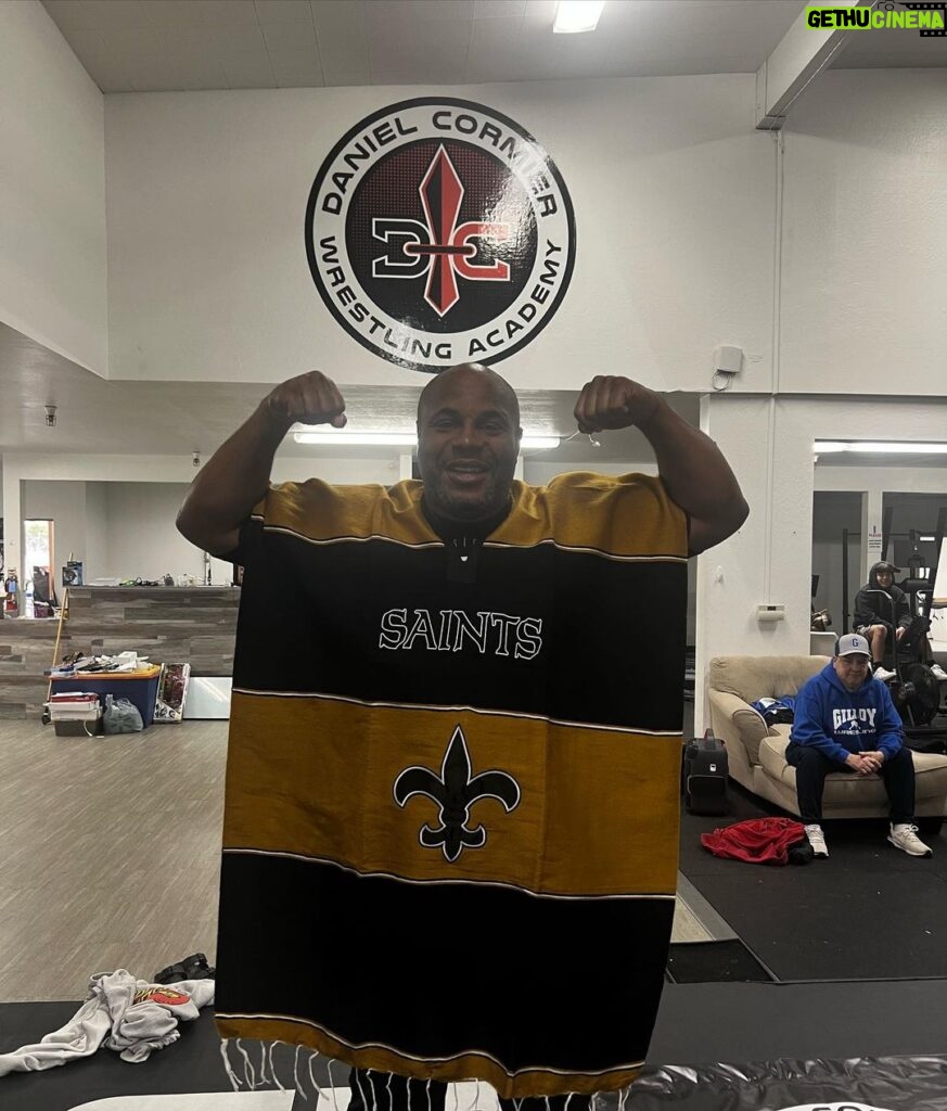 Daniel Cormier Instagram - Couple of my kids went down to Mexico and gave coach a gift. #gosaints it’s my new everyday wear. @danielcormierwrestlingacademy @gilroywrestling