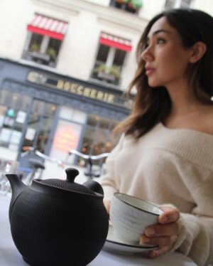 Daniel Gillies Instagram - my amazing girlfriend @msjuliamisaki recently launched the remarkable HIKARI TEA available domestically in the United States. 

go to hikaritea.com or hit the link in my bio.

100% organic loose leaf japanese tea and i’m not certain it doesn’t have actual magical properties.

quite honestly, I consider it one of the essential elements of my day now. zero ‘speediness’ that I often find with coffee; only mental clarity and calm. 

the quality of the flavor is so beautiful: the subtlety of texture and the rich fullness of the leaf.

go to her site and order some or I’ll hunt you down. 🇯🇵❤️🫖

meanwhile here are some pics of Julia and I wandering through Japanese gardens, me reading a book and staring pensively into the distance (not at all staged and YES you can buy that adorable teapot from the site) and Julia looking 🔥 in Paris (also drinking tea). 

❤️❤️❤️