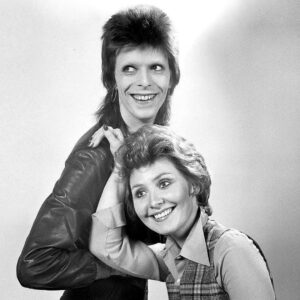 David Bowie Instagram - LULU’S MAN WHO SOLD THE WORLD IS FIFTY TODAY

“He said I was his friend...”

Fifty years ago today on Friday 11th January 1974, a 25-year-old Lulu launched the first of a few career resurrections in the shape of the Bowie-penned 45, The Man Who Sold The World/Watch That Man.

Produced and arranged by David Bowie and Mick Ronson the track reached #3 on the official UK singles chart, Lulu's first top ten hit for five years.

It's a superb record with a cracking arrangement quite different to the original Bowie track first recorded for the album of the same name in 1970.

Bowie provided backing vocals and a wonderful sax hook, while Ronno plays a solid riff throughout, all new to Lulu’s version which was recorded in France during the Pin Ups sessions.

The unlikely coupling created lots of press around the release, the Daily Mirror article in our montage being just one such item.

Apparently, David was more than a bit partial to the Lulu version himself, this from the Moonage Daydream book: 

“Lulu is such a bright, funny and talented little thing. When I first heard her version of 'Shout' I was initially gobsmacked that anybody British had the nerve to cover that Isley Brothers classic. Then I realised that she had actually done a great job with it. How the idea came up for having her do a version of 'Man Who Sold The World' I have no clue, but I'm so glad we did it. I used the Pin Ups line-up to back her, including Ronson and drummer Aynsley Dunbar, and played the sax section on overdubs. I still have a very soft spot for that version, though to have the same song covered by both Lulu and Nirvana still bemuses me to this day.”

Lulu went on to record a couple more songs with David that ended up on his own Young Americans album after he decided to keep them for himself...but that's another story.

Check out Lulu singing The Man Who Sold The World here on YouTube: http://smarturl.it/LuluTMWSTW (Linktree in bio)

📸 Kent Gavin

#BowieLulu50th #Bowie1974