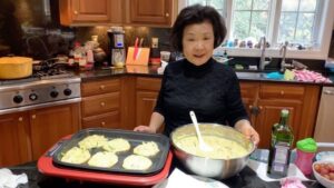 David Chang Instagram - I miss momma Chang…she’s the star of the first season of @uglydelicious. Here she was making her famous bin dae ttuk….Tomorrow at 7pm EST @netflix on their tik tok channel…is hosting a watch party of season 1 episode 3…the thanksgiving day episode. Come watch one of my favorite episodes. Link is in bio. 
❤️, 👶👑