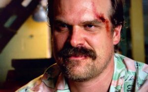David Harbour Instagram - In less than 24hours you can watch jim hopper act as stubborn, miserable, broken, and reckless as he’s ever been.  But all with a deeply irreverent inner glee, as wide and full as his ‘stache.  #strangerthings3 #july4th #biggerbadderhopper