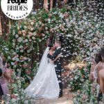 Derek Hough Instagram - "Regal redwoods" was the theme of @derekhough and @hayley.erbert's wedding in Carmel, California. From Hayley's custom Marchesa wedding gown and @inesdisanto reception dress to the opulent chandeliers and florals, see all the photos from their star-studded celebration at the link in bio. 📷: @amyandstuart 📋: @simplytroy 💐: Jimmy Hartman of @inblumela 👗: @marchesafashion and @inesdisanto 💇‍♀️: @jill901 💄: @emmawillishmu 🪧: @katecozziegraphicarts 🎥: @whiteinrevery 📍: @santaluciapreserve 🍰: @kellygraycakes 💡: @signaturechandeliers 🍽️: @theonicollection