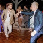Derek Hough Instagram - Love ❤️ these two humans and so happy to celebrate with them on their big day! What makes these photos even better is looking at the reactions of people in the background 😂… ooo a flower 🌸 📷: @christinamcneill