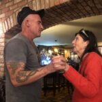 Dominic Purcell Instagram – Mum and me. Our last dance in the homeland #ireland🍀. 

Mum would have been 79 today. Not sure she’d be to stoked about that. Bit of a vain thing she was. 😂. 

It’s a terrible thing she passed so early. I think about her a lot of course and all the great stuff that’s happened in my life of late that she has missed. She’d be bragging on me to anyone that would listen whether they liked it or not about my marriage to my beautiful wife @tishcyruspurcell – they both would have adored one another. A cheeky whisper in my ear as was her wit. “punching above your weight Dominic”. I know mum, love u miss u heaps.❤️