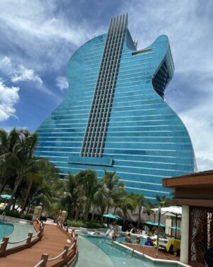 Gabriel Iglesias Instagram - Hello from one of the most incredible hotel/casinos in the world. The new @hardrockholly is literally in the shape of a guitar. #HardRockFluffy 🎸