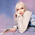 Grimes Instagram - Launching new A.I. Girl group NOV 12! (Were super behind on everything and you’ll all see why in a month or so , so I apologize abt delays of music and visuals. Gna be catching up on the girls visual development and whatnot - but me and @chrislake just needed to get this song out cuz it’s been going so hard at festivals!!!! (((((PS i included the un retouched image cuz this is more retouching than i normally do and whilst I look hot haha I do fear for the mental health effects of ye olde photo shoppé I may have had some filler mishaps over the years but def didn’t get a nose job haha