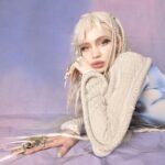 Grimes Instagram - Launching new A.I. Girl group NOV 12! (Were super behind on everything and you’ll all see why in a month or so , so I apologize abt delays of music and visuals. Gna be catching up on the girls visual development and whatnot - but me and @chrislake just needed to get this song out cuz it’s been going so hard at festivals!!!! (((((PS i included the un retouched image cuz this is more retouching than i normally do and whilst I look hot haha I do fear for the mental health effects of ye olde photo shoppé I may have had some filler mishaps over the years but def didn’t get a nose job haha