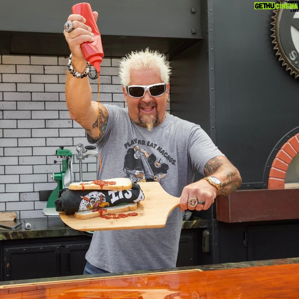 Guy Fieri Instagram - This season it’s all about the three F’s: Fans, Food, and Football! I teamed up with @officialnflshop to take fan gear up a notch by pairing your favorite @nfl team with my picks for the best local gameday grub. Available now at @officialnflshop 🔥