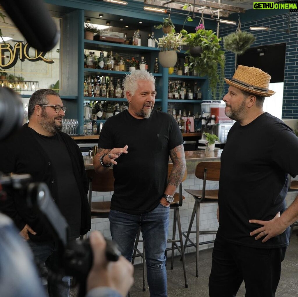 Guy Fieri Instagram - Diners, Drive-Ins and Dives! See Nic’s on Beverly on DDD this Friday Night on Food Network 😳 🍕 🍝 One of my favorite humans on earth, and one of the most giving humans I know, has invited us to his celebration of favorite restaurants in America. Guy Fieri! You rock🤘Love you brutha 🖤 His mission in life is to help others. And he did just that for nic’s. A few months back Guy brought his team in to document how we do things at Nic’s. As you will see I get to cook side by side with Guy, and a good friend to both of us, Chef Eric Greenspan. We had a blast, laughed a lot, shared stories, and enjoyed some delicious eats. Wow, what a day! Please come visit us when you can! We will be launching a brand new pizza this Friday that will debut on Triple D, Lionsmane Asada Detroit-style pizza. Come in soon and try it. Also, many of your favorite classic nic’s cocktails are back on the menu for a limited time as well. Thank you, Jason Eisner 😘 We are so lucky to be here serving you, thank you for the continued support! 💚 - nic PS Nic’s team you are the best 🙏 Thank you to our former Chef, Jared Simons, for the delicious recipes featured in this episode, and thank you Chef Randy for leading us forward. And GM David for keeping it all together. LFG! ⁣ .⁣ .⁣ .⁣ .⁣ .⁣ #eater #eeeeeats #forkyeah #foodnetwork #veganeats #veganfood #vegansofig #plantbased #veganism #vegancommunity #vegetarian #whatveganseat #vegansofinstagram #veganrecipes #vegan #ddd #dinersdriveinsanddives #flavortown #knowyourfood #guyfieriapproved #tripled #foodie #tasty #guyfieriatehere #guyfieri #eaterla #vegoutla #vegnews Nic's on Beverly