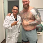 Hafþór Júlíus Björnsson Instagram - WARNING GRAPHIC SURGERY FOOTAGE. Live on my YouTube channel. Wednesday I’m 4 weeks post surgery. Sadly I got an infection 5 days ago resulting in an abscess and had to have a drainage tube inserted. Finally had that removed today. Swipe to see the length of it! 🤯