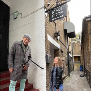 Ian McKellen Instagram - I chanced on a photo of the 17 year old Millie Anna outside the Theatre Royal, Martin Shaw and me in the background. It turned out Millie Anna  @outwith_millieanna is an aspiring model with the @zebedeetalent agency and outspoken about Down Syndrome. I had a cousin with the same condition. Now she has shown me around Windsor, under the loving guidance of her father Jeffrey, who snapped us on our way.