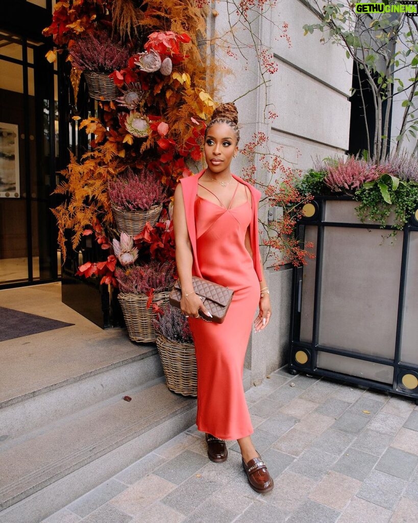 Jackie Aina Instagram - let me wear burnt orange ONE TIME 🤭 slip dress + cardigan: All Saints shoes + handbag: Chanel One Aldwych