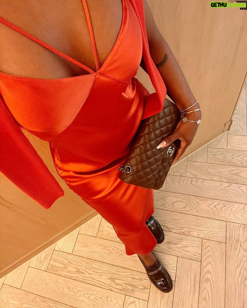 Jackie Aina Instagram - let me wear burnt orange ONE TIME 🤭 slip dress + cardigan: All Saints shoes + handbag: Chanel One Aldwych