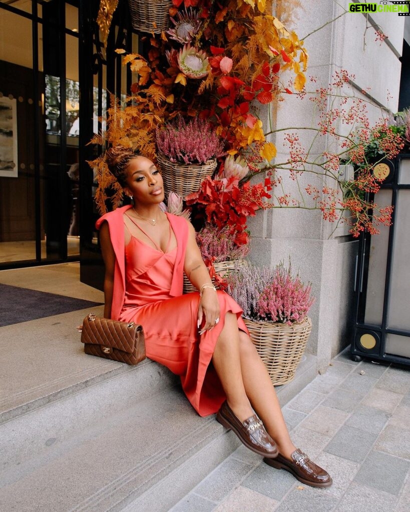 Jackie Aina Instagram - let me wear burnt orange ONE TIME 🤭 slip dress + cardigan: All Saints shoes + handbag: Chanel One Aldwych