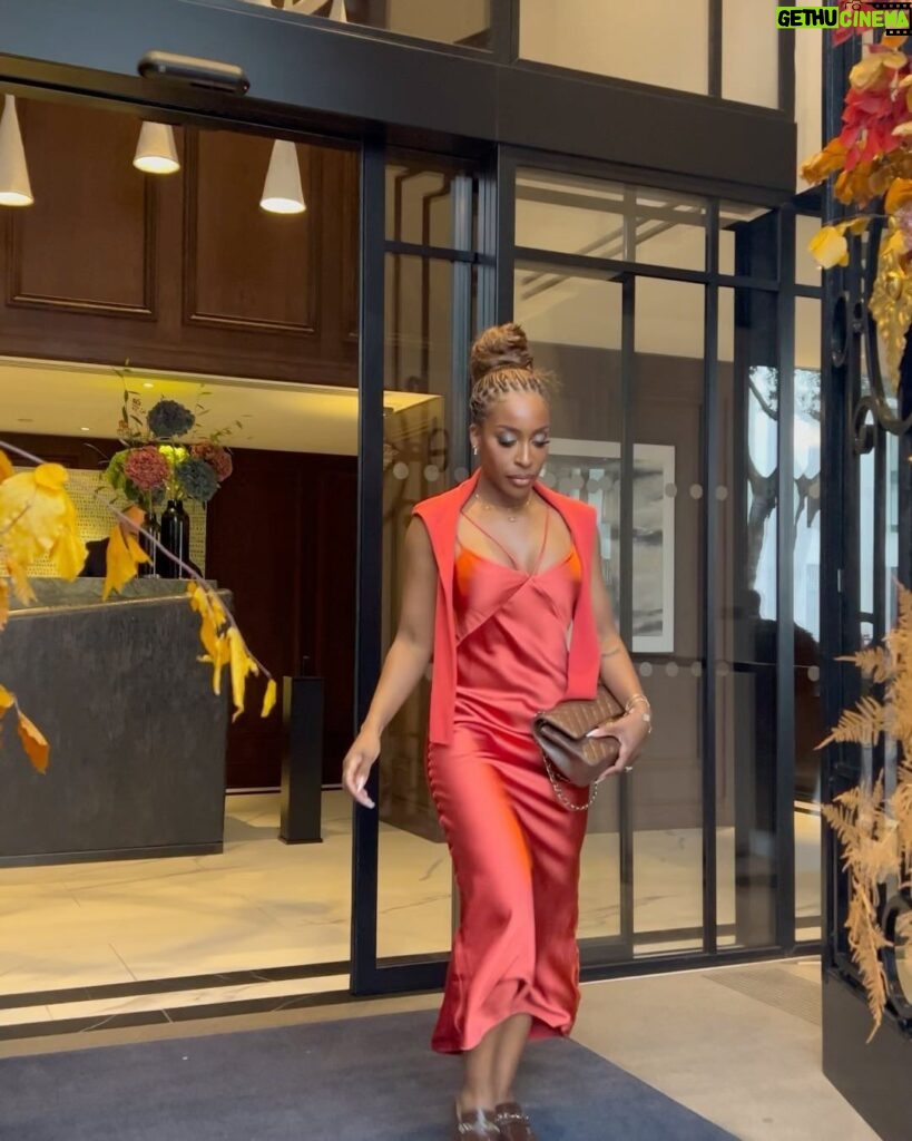 Jackie Aina Instagram - let me wear burnt orange ONE TIME 🤭 slip dress + cardigan: All Saints shoes + handbag: Chanel One Aldwych