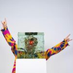 Jacob Collier Instagram - The artwork for Djesse Vol. 4 is in fact a real-life glass sculpture!! It was crafted by my brilliant maverick friend @dustinyellin - one of the most breathtaking artists currently roaming Earth. It’s built from 30 sheets of glass, glued together, and between each are placed over 3000 tiny cut-up paper people, creatures, instruments, shapes, life forms, friends, foes, relics of Djesse - in a mass smatterdom of flavour. Having been an avid drinker of Dustin’s worlds since the dawn of Djesse, this is LITERALLY a dream come true. I urge you to feast on the plentiful spoils of his universe that exist in the world and across the interwebs. And if you want to have a look around - a fully explorable virtual model of this sculpture exists over at jacobcollier.com! Easter eggs abound. Enough for everybody. Help yourself. Djesse Vol. 4 is out on February 29th - 3 weeks today - and I have never been more excited in my life. More soon.