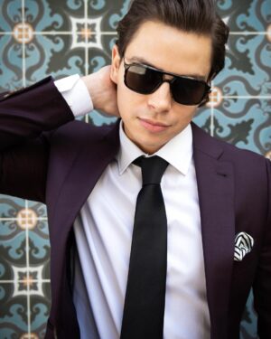 Jake T. Austin Instagram - Captions and comments are cool, but I always look forward to connecting with you more comprehensively. I recently had a conversation with @hauteliving about my current life and goals for the future: check it out at hauteliving.com. And of course, thanks to all of you for continuing to show your love; I wouldn’t be here without you. #summersolstice
Shoutout to the creative team:
Photographer: @mitchdao.photos
Suiting/attire: @indochino
Shoes/accessories: @shopnewrepublic @menlohouse
Eyewear: @prada
Venue: @lapeerhotel
