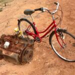 James May Instagram - The artist ironically juxtaposes the bicycle with the rusting remains of an unwanted internal combustion engine (estimate £20,000 - 30,000)