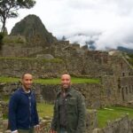 Jason Oppenheim Instagram - Travel photos from when Brett and I quit our jobs as attorneys to travel the world for three years, visiting 80 countries and more than 200 cities! Can you guess where these photos are from? Answers… 1. Machu Picchu, Peru 2. Bay of Kotor, Montenegro 3. Taj Mahal, India 4. Angkor Wat, Cambodia 5. Great Wall of China 6. Red Square, Moscow 7. Great Pyramids, Egypt 8. Copacabana Beach, Brazil 9. Ethiopia, Africa 10. Parthenon, Greece