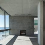 Jason Oppenheim Instagram - Coming Soon in Malibu - 24844 Malibu Rd. - $53,000,000 An architectural tour de force and only one of the few private homes in the United States designed by the renowned Pritzker Prize-winning Japanese architect, Tadao Ando. Best known for his minimalist structures and his assured use of reinforced concrete, Ando’s trademark design of “smooth-as-silk” concrete is wholly present in the structure and surface of the home. Constructed of approximately 1,200 tons of concrete, 200 tons of steel reinforcement, and 12 massive pylons driven more than 60 feet into the sand with AD100 architecture firm Marmol Radziner acting as executive architect and general contractor, the structure is an everlasting beacon of permanence on California’s coastline. Natural light is used creatively throughout the space, another signature of Ando, to manipulate a warm feeling throughout the building and harmonize with its natural surroundings. The home spans +/- 4,000 sq. ft. of interior space and approximately 1,500 sq. ft. of outdoor decks with ocean views from every room. Currently all interior finishes have been removed from the property, and work is needed to either restore or reimagine the interiors. Thoughtfully located on the prestigious and quiet Malibu Road, with easy access and close proximity to the finest restaurants, shopping, and entertainment in all of Malibu. An exceedingly rare architectural achievement that should be seen as a masterful work of art, rather than just a residence. Malibu Beach