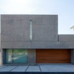 Jason Oppenheim Instagram - Coming Soon in Malibu - 24844 Malibu Rd. - $53,000,000 An architectural tour de force and only one of the few private homes in the United States designed by the renowned Pritzker Prize-winning Japanese architect, Tadao Ando. Best known for his minimalist structures and his assured use of reinforced concrete, Ando’s trademark design of “smooth-as-silk” concrete is wholly present in the structure and surface of the home. Constructed of approximately 1,200 tons of concrete, 200 tons of steel reinforcement, and 12 massive pylons driven more than 60 feet into the sand with AD100 architecture firm Marmol Radziner acting as executive architect and general contractor, the structure is an everlasting beacon of permanence on California’s coastline. Natural light is used creatively throughout the space, another signature of Ando, to manipulate a warm feeling throughout the building and harmonize with its natural surroundings. The home spans +/- 4,000 sq. ft. of interior space and approximately 1,500 sq. ft. of outdoor decks with ocean views from every room. Currently all interior finishes have been removed from the property, and work is needed to either restore or reimagine the interiors. Thoughtfully located on the prestigious and quiet Malibu Road, with easy access and close proximity to the finest restaurants, shopping, and entertainment in all of Malibu. An exceedingly rare architectural achievement that should be seen as a masterful work of art, rather than just a residence. Malibu Beach