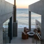Jason Oppenheim Instagram - Coming Soon in Malibu - 24844 Malibu Rd. - $53,000,000 An architectural tour de force and only one of the few private homes in the United States designed by the renowned Pritzker Prize-winning Japanese architect, Tadao Ando. Best known for his minimalist structures and his assured use of reinforced concrete, Ando’s trademark design of “smooth-as-silk” concrete is wholly present in the structure and surface of the home. Constructed of approximately 1,200 tons of concrete, 200 tons of steel reinforcement, and 12 massive pylons driven more than 60 feet into the sand with AD100 architecture firm Marmol Radziner acting as executive architect and general contractor, the structure is an everlasting beacon of permanence on California’s coastline. Natural light is used creatively throughout the space, another signature of Ando, to manipulate a warm feeling throughout the building and harmonize with its natural surroundings. The home spans +/- 4,000 sq. ft. of interior space and approximately 1,500 sq. ft. of outdoor decks with ocean views from every room. Currently all interior finishes have been removed from the property, and work is needed to either restore or reimagine the interiors. Thoughtfully located on the prestigious and quiet Malibu Road, with easy access and close proximity to the finest restaurants, shopping, and entertainment in all of Malibu. An exceedingly rare architectural achievement that should be seen as a masterful work of art, rather than just a residence. Malibu Beach