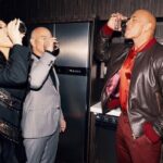 Jeff Bezos Instagram - What an honor to be with you on your special night. Repost from @therock • Awesome @teremana toast with our ohana @jeffbezos & @laurenwsanchez 🥃🖤 “To adventure, fellowship and our People’s Champ” ~ Jeff Thank you, brother for the toast and for the incredibly effusive words you spoke on my behalf on stage ~ and most of all for being a helluva drinking buddy 🤣👊🏾 -dj #peopleschoiceawards #thepeopleschampaward
