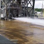 Jeff Bezos Instagram - First hotfire of our #BE7 lunar landing engine just yesterday at Marshall Space Flight Center. Data looks great and hardware is in perfect condition. What you’re seeing at the bottom is a water cooling system and the green flame is the ignition system. The engine plume you see is very clear because the fuel is hydrogen. Test went full planned duration – 35 seconds. Kudos to the whole @BlueOrigin team and grateful to @NASA_Marshall for all the help!
