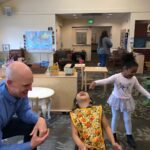 Jeff Bezos Instagram - Had a great meeting with @michael.m.george. We’re hard at work building Day 1 Academies, and Mike has been busy learning from the best in the field. Here are a few pictures from his listening tour – visiting the smart and kind early educators from Montessori at Wesley, outside Seattle, in addition to Wildflower Schools and the Montessori Center of Minnesota. Stay tuned – we’re laser focused on helping underserved communities educate young and vulnerable kids in need.