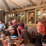 Joe Manganiello Instagram - Got the band back together after three years of remote play and no play… WAR OF DRAGONS Episode 73 kicked off with a food truck and a two hour recap from the very first adventure five years ago, all the way through to the present. The Sandal of Gygax made its appearance as it settled into its new home for the next calendar year at The E. Gary Gygax Memorial Dungeon in Beverly Park next to a set of Gary’s dice gifted to me by his son Luke for my 42nd birthday a few years back. Vince spearheaded a surprise for me, a framed piece of art by Max Dunbar that was used to craft the Wizkids miniatures sets, including all of the characters in the group but this time, with a looming Tiamat above. So f-ing cool… It was a blast seeing everyone in person! Can’t wait for the next session.