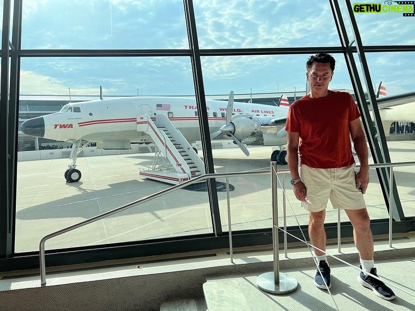 John Barrowman Instagram - It’s Throwback Saturday and we’re flying TWA! This is the Eero Saarinnen TWA terminal at JFK - Now converted to a fabulous retro hotel. @scottmale #lgbtqia #jfk #retro #airline #twa Sayville Ferry Service