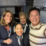 John Barrowman Instagram – It was team work today on our @americanair flight from Los Angeles to London.
I became the honorary Engineer on the flight helping this fantastic team. I’ll tell you the story at the panel. @comicconafrica 
#travel #lgbtq #Fanfamily #airline  #problemsolving Heathrow Airport
