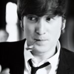 John Lennon Instagram - What's your favourite song from the early Beatles ‘black and white’ era? Photos: John Lennon making faces to Max Scheler in a break from filming 'A Hard Days Night' on a train between London Paddington and Minehead, UK, March 1964