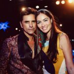 John Stamos Instagram - I thank my beautiful wife who knows how to throw a party - Fake Beatles, @raintribute (the best Beatles band ever!) Real Beach Boys, @mikeloveofficial @jamieleecurtis handing out @stamos bracelets, @glenpowell riding some big cow-like animal, all my friends, family, (party crashers) it was a 60’s party that was better than the actual 60’s ! 📸 @micalaaustin @canyonagoura THANK YOU!