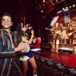 John Stamos Instagram - I thank my beautiful wife who knows how to throw a party - Fake Beatles, @raintribute (the best Beatles band ever!) Real Beach Boys, @mikeloveofficial @jamieleecurtis handing out @stamos bracelets, @glenpowell riding some big cow-like animal, all my friends, family, (party crashers) it was a 60’s party that was better than the actual 60’s ! 📸 @micalaaustin @canyonagoura THANK YOU!