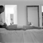 Johnny Knoxville Instagram - Oh man, just came across this photo and can’t stop giggling. It’s a 1965 shot of Frank Sinatra getting a massage in his suite at Miami’s Eden Roc Hotel. So goddamn funny. The BVD’s, skinny legs and the socks. 👏 I sent the photo to my cousin @rogeralanwade and he shot back, “Dang cuz, ol’ Frank’s crotch looks like the plains of Nebraska. He was either tucking it or Ava Gardner was lying like hell.” 📸 by John Dominus for Life Magazine