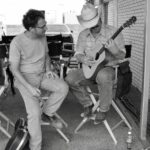 Josh Brolin Instagram - Showing Ethan Coen that a guitar makes noise and that you can place your fingers in certain places along what they call ‘the neck’ to create languages that make certain parts of your body move involuntarily. This was right before he started moving, involuntarily. #nocountryforoldmen #between shots #backwhenmovieswereworkingclass