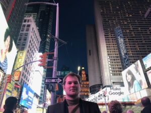 Justin Prentice Instagram - If the lights of a city can make the night as bright as day, you're living in the future.

My face is pink.

@hamiltonmusical is amazing.

The pizza here is decent 😜

#newyork #timessquare #nyc