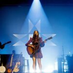 Kacey Musgraves Instagram – Starting this chapter in Nashville on @theryman’s hallowed ground is so meaningful to me. Last night’s “Deep Into The Well” album release show had me flooded with so much emotion I could barely sing at a certain point. Being that vulnerable in front of people isn’t super easy for me. Thank you for everyone who cried with me, helped make this record happen, and to those who are loving it. 🤍 Also. I partnered with @crcompact to ensure that for every single person that bought a ticket to the show a tree would be planted in Nashville. Thanks to you we’ll be planting 2,400 trees to give some roots back to the city as it continues to grow. Ryman Auditorium