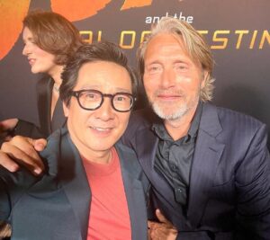 Ke Huy Quan Instagram - Indy will always be a hero to Short Round and Harrison Ford will always be a hero to me❣️

I wish he could continue in this role forever, but I was happy to be there last night to see him crack that whip one more time. Dial of Destiny is SO GOOD!!! Please go see it comes June 30th!

(Can you spot another cast member from Temple of Doom? Hint: he loves voodoo dolls 😜)

📸: @gettyimages 

Styling: @chloekeiko 
Grooming: @sonialeeartistry 
Outfit: @paulsmithdesign 
Glasses: @cutlerandgross 
Watch: @omega 
Shoes: @churchs 

@indianajones @lucasfilm @disney