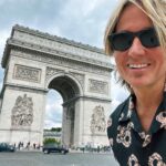 Keith Urban Instagram - So we’re back in Paris 3 years later….and I take what I think is the EXACT same photo (aside from the obvious differences — clothes, etc.) After I left, I realized what I’d completely overlooked. Classic. If you spot the difference, let me know in the comments ! 🙃 In other news, Brown Eyes Baby is out tonight !!!!!! Paris, France