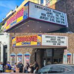 Kevin Smith Instagram - The Jersey Girl came to see JERSEY GIRL! @raquelxcastro paid a visit to my beloved @smodcastlecinemas to cap off a Memorial Day weekend full of shows! On Friday, we showed JAWS as part of the Movies That Made Me series. Then on Saturday night, we watched my flick RED STATE. But Sunday saw a reunion with the little girl who, at age 7, preternaturally played the role of Gertie in my sixth flick. We screened what we were calling JERSEY GIRL: The Snyder Cut, because it was the longest version of the flick ever edited, with an entire first act full of @jlo that got cut out due to post-Gigli hysteria. I haven’t seen any cut of JG since 2006, so it was a trip to see the movie I originally made #bennifer two decades ago. Hopefully, @paramountplus will want to stream it in 2024 for the 20th anniversary. It’s almost an entirely different flick. Also entirely different: Raquel, who’s now about 2 years younger than her cinematic Dad #benaffleck was when we shot it. I was happy to discover our troubled film didn’t ruin Rocky, who grew up to be such a wonderful kid with a great head on her shoulders. I can’t thank her enough for a killer kid performance, as well as for making the trip all the way from L.A. to be at #smodcastle with an ardent audience. It was a lovely weekend (with 3 profitable pre-show auctions, thank you bidders), during which I got to wear a trio of different jackets, as well as my new Smodcastle sneakers made by @1craftypunk! Next up: BABBLE-ON this Saturday and WATCH WITH KEV: @dctheflash on June 15, 16 & 17! Tickets available now at SmodcastleCinemas dot com! Take a trip to Smodcastle, where the movies come to play! #KevinSmith #smodcastlecinemas #raquelcastro #jersey #newjersey #film