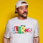 Kevin Smith Instagram - HAPPY CLERKS DAY! 30 years ago from today, CLERKS debuted at the 1994 Sundance Film Festival! That means, if you ever wanted to stop me or my career from happening, youʼd send a Terminator back to this moment in time 3 decades back. Mercifully, there was no robotic hunter/killer trying to kill me at Sundance that year. The inaugural screening took place at the Holiday Village Cinema in a sold out 150 seater. That was the first time I got to see my first film with a full audience. The sheer thrill of finding out that ideas Iʼd had years prior actually held up to public scrutiny from strangers was intoxicating (but that also might have had something to do with the thin air at the high altitude). That first screening started the buzz that powered the next three screenings and a deluge of press about the black and white New Jersey convenience store movie and the director who was going back to work there after the Festival ended. By our fourth and final Sundance screening at The Egyptian Theater on Main Street in Park City, Clerks was being talked about and written about like it was well worth watching. As he introduced me and the film, Festival head Geoff Gilmore described me in a way that still gets me in the feels when he said “If Kevin Smith didnʼt exist, the Sundance Film Festival wouldʼve had to invent him.” Mine was a Cinderella-ish or Rocky-like tale that reminded folks anyone can take a shot at their dreams and maybe find a modicum of success - even if theyʼre from New Jersey. Do you have a dream (one that doesnʼt involve hurting people or animals, destruction or death)? 2024 is the year you move closer to your goal and take your shot on yourself. Many thanks to Brian, Jeff, Jay, Marilyn, Lisa, Scott, Dave, Kim, Virginia, Donald, Mom, Dad, the Thapars, and everyone else who helped me craft Clerks! Many thanks to Sundance, Mark Tusk, Bob Hawk and John Pierson for guiding a gobsmacked newcomer in his sudden success. And many thanks to you, my friends, for 30 years of continued interest in the Askewniverse adventures of retailing rascals Head over to JayAndSilentBob dot com TODAY to shop our anniversary sales! #KevinSmith #clerks #film