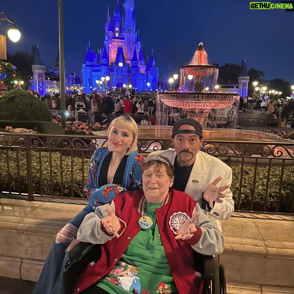 Kevin Smith Instagram - HAPPY 78th BIRTHDAY, MOM! It was a rough year for @donsgirlgrace, with far too many hospital stays. So to celebrate her victory over the infinite, we took Mom to @waltdisneyworld for her birthday today! All she wanted was a photo with Santa and cotton candy, so she got both. I’m grateful to ring in another year and she was ecstatic to spend the day with her kids, her granddaughter, and her niece. #KevinSmith