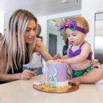 Lala Kent Instagram - I’m still dying over Ocean’s birthday party. I’ve gotten A LOT of messages asking about everything. So here are some pictures and you can find the contacts below 🤍🌊🥳 Photography: @jessicaczarneckicreative Party planners: @picnic_and_petal @glitzandgather Table setting + styling: @picnic_and_petal Balloon installation + styling: @glitzandgather Florist: @lovestruckblooms Acrylic goods: @atomickraftworks Graphic design: @winkandinkpaperie Custom backdrops: @trudesign.contracting Party supplies: @paperandparties Custom party hats + wands: @winnieandhaze Table linens: @cvlinens Custom neon sign: @sketchandetch.neon Cake: @thegateauxshoppe_ Custom macarons + macaron tower: @boymama_bakes Custom sugar cookies: @megans.bakes Candy tray and personalized pouches: @madesweet_byamanda Soft play: @modernkidsplaycompany Mini bounce house: @minicastlesco Custom shirts: @freshbakedteesprintshop Custom bathing suits + trucker hats: @sunnyboutiquemiami Custom Visors + cups: @bubblyandbash Custom sunglasses: @estherbrophoenix Custom air fresheners: @dangle_it Custom can coolers: @carolinacancoolers Custom tissue paper + stickers: @coacousa Custom crayons: @thecrayonclique Custom coloring books: @munchkinlanellc Seashell towels: @shopthemagicbox Coolers: @revocoolers Sparkling water: @sanpellegrino_us @perrierusa Wine: @avaline Venue: @mrjaxtaylor @brittany @littlebabycauchi house