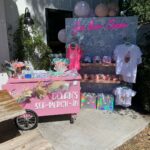 Lala Kent Instagram - I’m still dying over Ocean’s birthday party. I’ve gotten A LOT of messages asking about everything. So here are some pictures and you can find the contacts below 🤍🌊🥳 Photography: @jessicaczarneckicreative Party planners: @picnic_and_petal @glitzandgather Table setting + styling: @picnic_and_petal Balloon installation + styling: @glitzandgather Florist: @lovestruckblooms Acrylic goods: @atomickraftworks Graphic design: @winkandinkpaperie Custom backdrops: @trudesign.contracting Party supplies: @paperandparties Custom party hats + wands: @winnieandhaze Table linens: @cvlinens Custom neon sign: @sketchandetch.neon Cake: @thegateauxshoppe_ Custom macarons + macaron tower: @boymama_bakes Custom sugar cookies: @megans.bakes Candy tray and personalized pouches: @madesweet_byamanda Soft play: @modernkidsplaycompany Mini bounce house: @minicastlesco Custom shirts: @freshbakedteesprintshop Custom bathing suits + trucker hats: @sunnyboutiquemiami Custom Visors + cups: @bubblyandbash Custom sunglasses: @estherbrophoenix Custom air fresheners: @dangle_it Custom can coolers: @carolinacancoolers Custom tissue paper + stickers: @coacousa Custom crayons: @thecrayonclique Custom coloring books: @munchkinlanellc Seashell towels: @shopthemagicbox Coolers: @revocoolers Sparkling water: @sanpellegrino_us @perrierusa Wine: @avaline Venue: @mrjaxtaylor @brittany @littlebabycauchi house