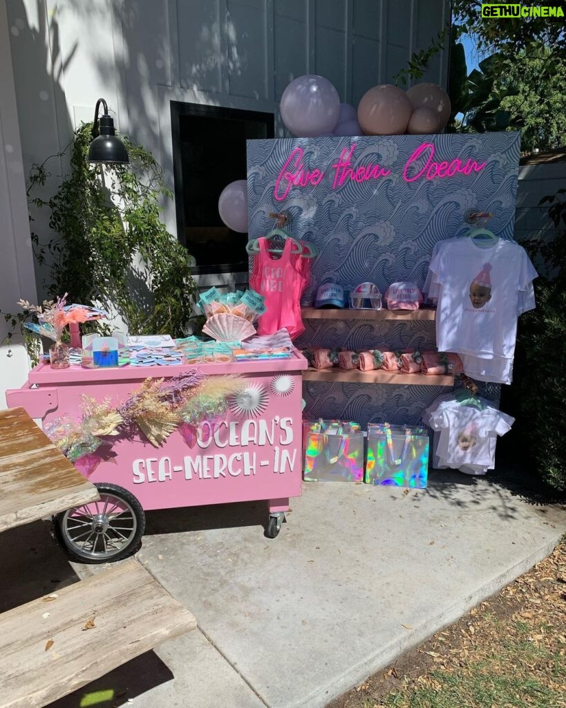 Lala Kent Instagram - I’m still dying over Ocean’s birthday party. I’ve gotten A LOT of messages asking about everything. So here are some pictures and you can find the contacts below 🤍🌊🥳 Photography: @jessicaczarneckicreative Party planners: @picnic_and_petal @glitzandgather Table setting + styling: @picnic_and_petal Balloon installation + styling: @glitzandgather Florist: @lovestruckblooms Acrylic goods: @atomickraftworks Graphic design: @winkandinkpaperie Custom backdrops: @trudesign.contracting Party supplies: @paperandparties Custom party hats + wands: @winnieandhaze Table linens: @cvlinens Custom neon sign: @sketchandetch.neon Cake: @thegateauxshoppe_ Custom macarons + macaron tower: @boymama_bakes Custom sugar cookies: @megans.bakes Candy tray and personalized pouches: @madesweet_byamanda Soft play: @modernkidsplaycompany Mini bounce house: @minicastlesco Custom shirts: @freshbakedteesprintshop Custom bathing suits + trucker hats: @sunnyboutiquemiami Custom Visors + cups: @bubblyandbash Custom sunglasses: @estherbrophoenix Custom air fresheners: @dangle_it Custom can coolers: @carolinacancoolers Custom tissue paper + stickers: @coacousa Custom crayons: @thecrayonclique Custom coloring books: @munchkinlanellc Seashell towels: @shopthemagicbox Coolers: @revocoolers Sparkling water: @sanpellegrino_us @perrierusa Wine: @avaline Venue: @mrjaxtaylor @brittany @littlebabycauchi house