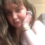 Lena Dunham Instagram - Hello from the floor of quarantine in London, where I am in full isolation in accordance with Tier 4 lockdown laws! But the chance to be alone with only a bag of crisps and my thoughts before I go full bore into the most ambitious project of my career has been a special lil' gift- it's given me a moment to reflect on the strength and stability I feel as I barrel toward my *official* mid-thirties, and how deeply it contrasts with the flightiness and fragility of my twenties. And it's funny, because my twenties were much flashier- more outward facing achievement, more dresses and liquid eyeliner and taking my shoes off at parties and being told I was doing a hot job. But I was fighting my ass off to stay in the mix, for fear of what a moment of quiet might reveal to me- the roaring in my ears, the scraping in my brain. The last three years- since Girls ended, since my health and long term relationship collapsed at once and I had to rebuild myself in a new body and home, since I got sober and learned what it meant to really sit with myself- have been deafeningly quiet. But in that silence, more has occurred than ever did when I was dancing as fast as I could. I've discovered my own values. I've taken up dorky hobbies. I've built and scrapped and replotted dreams. I've healed without even knowing it was happening. I've planted the seeds for the kind of life I thought I was living but I was only playing at before- one full of art and friendship and honesty and love. I've motored my own boat (that... sounded wrong?) I guess this post is a glowing recommendation for quiet, in all its forms. It's the opposite of boring. What's boring is staying at the party too long. What's cool is sitting in the bathtub afterwards. What have you found in the silence lately? London, United Kingdom
