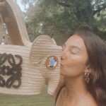 Lily Aldridge Instagram - This @LOEWE Elephant basket bag has been created in collaboration with the #KnotOnMyPlanet campaign. Its eyes are hand-beaded by Samburu craftswomen 🐘 The proceeds go to the @ElephantCrisisFund, helping to secure a future for elephants 🫶 Did you know... that elephants lie down for an average of 2 hours a night and snooze during the day standing up 🥰 Shop yours on loewe.com #LOEWEkomp #KnotOnMyPlanet @samburutrust @knotonmyplanet @jonathan.anderson